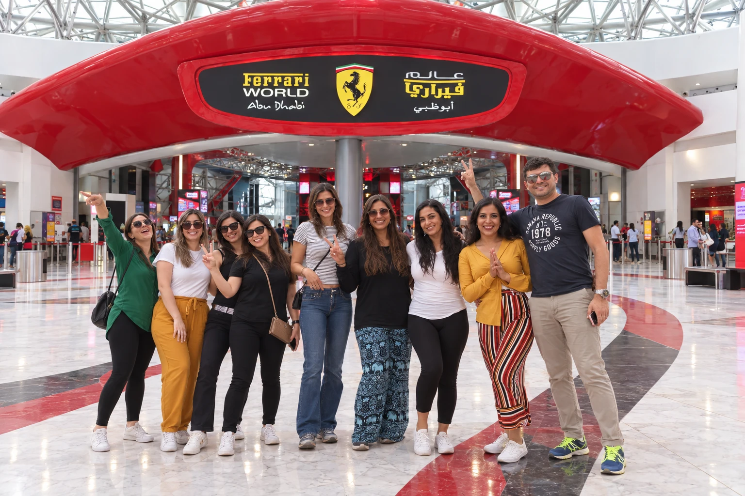 Travelers taking a photo with the famous Ferrari world Them Park entrance